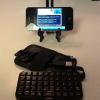 "MINI BLUETOOTH POCKET KEYBOARD FOR CELL PHONE" (SEEN HERE WITH iPHONE 4).  LOGMEIN 'IGNITION' APP IS RUNNING THE ISS 2 METER PACKET PROGRAM 'UISS' ON HOME RADIO COMPUTER BY REMOTE CONTROL.